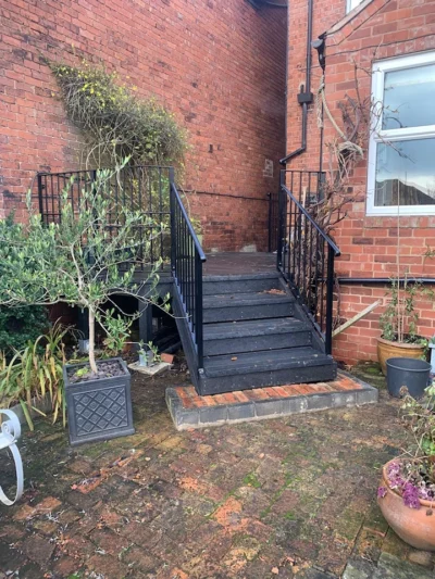 black painted iron railings and steps (domestic property)